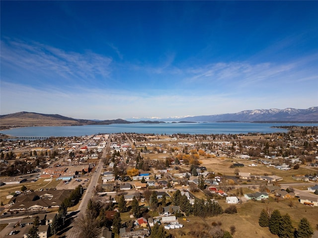 1807 1st St E, Polson, MT 59860 - aerial overview of property's location with a water and mountain view and nearby suburban area
