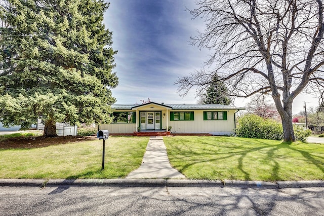 2046 Fairway Dr, Billings, MT 59102 - ranch-style house featuring a standing seam roof, a front yard, metal roof, and board and batten siding