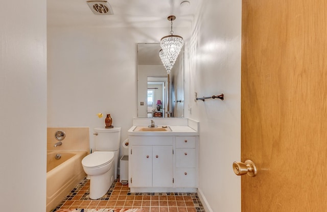 2046 Fairway Dr, Billings, MT 59102 - bathroom featuring toilet, a tub, vanity, a chandelier, and tile patterned flooring