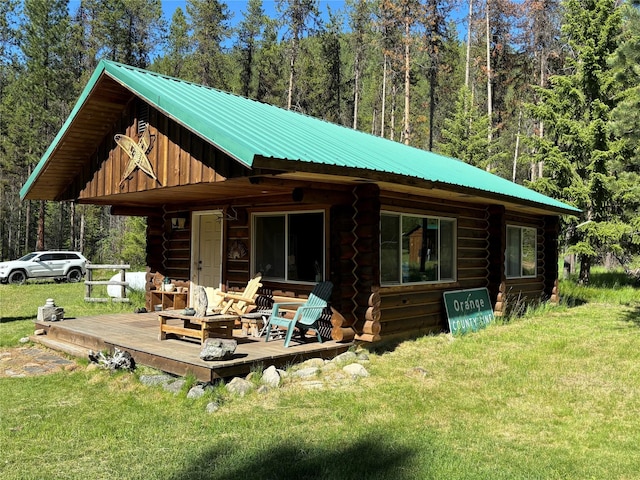 127 Lonely Moose Ln, Alberton, MT 59820 - rear view of property featuring log exterior, a lawn, a deck, and metal roof