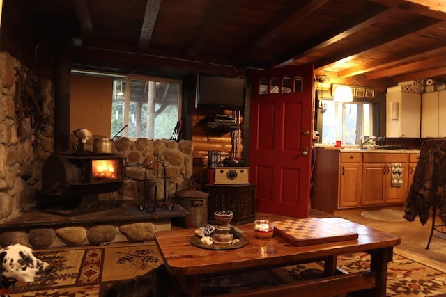 127 Lonely Moose Ln, Alberton, MT 59820 - living room featuring wood ceiling with exposed beams and a wood stove
