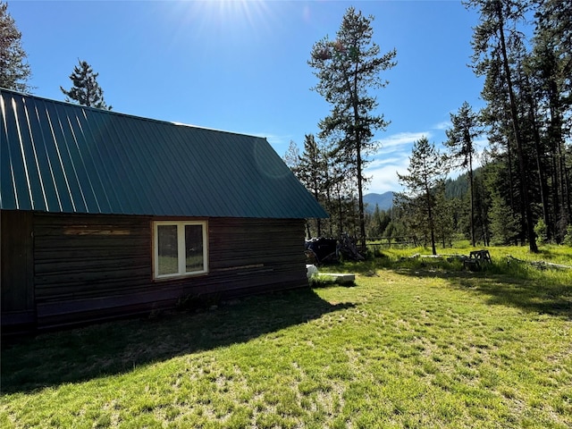 127 Lonely Moose Ln, Alberton, MT 59820 - view of home's exterior featuring a lawn, metal roof, and a mountain view