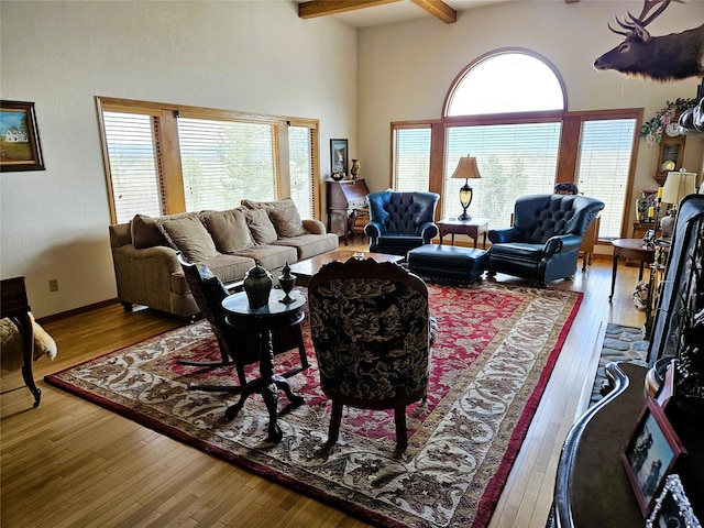 215 Somerset Dr, Kalispell, MT 59901 - living room featuring hardwood / wood-style floors, beam ceiling, plenty of natural light, and a high ceiling