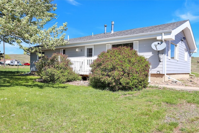 5 Lake Flat Ln, Great Falls, MT 59404 - rear view of property with a lawn and roof with shingles