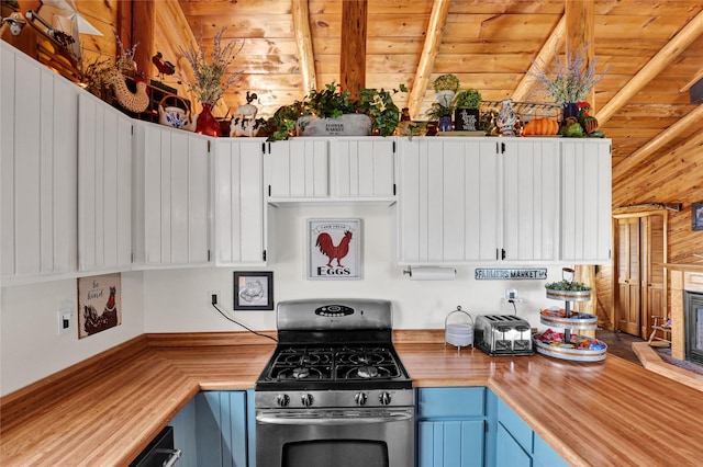5 Lake Flat Ln, Great Falls, MT 59404 - kitchen featuring stainless steel range with gas stovetop, blue cabinets, a wood ceiling with exposed beams, butcher block counters, and white cabinetry
