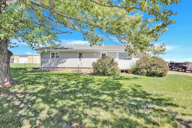5 Lake Flat Ln, Great Falls, MT 59404 - rear view of house with a lawn