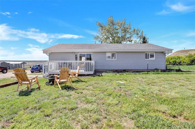 5 Lake Flat Ln, Great Falls, MT 59404 - back of property featuring a deck and a yard