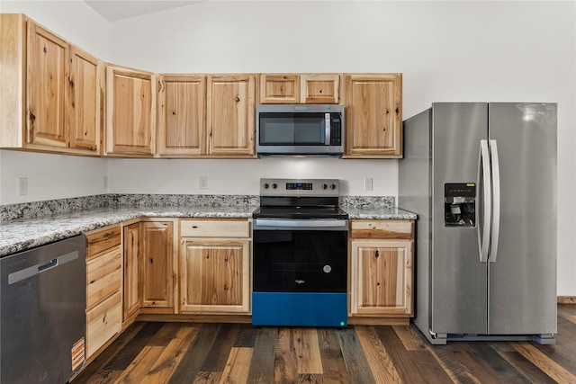 4452 Ludwig Ln, Stevensville, MT 59870 - kitchen featuring stainless steel appliances, dark wood-type flooring, light stone countertops, and light brown cabinets