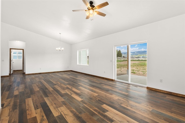 4452 Ludwig Ln, Stevensville, MT 59870 - unfurnished room featuring vaulted ceiling, a chandelier, dark wood finished floors, ceiling fan, and baseboards