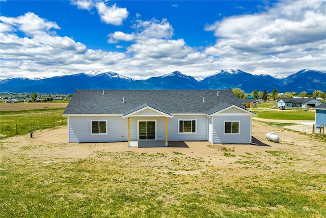 4452 Ludwig Ln, Stevensville, MT 59870 - view of front of property featuring a mountain view, a patio, and a front yard