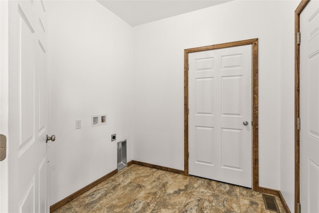 4452 Ludwig Ln, Stevensville, MT 59870 - laundry area with baseboards, hookup for a washing machine, electric dryer hookup, and stone finish floors