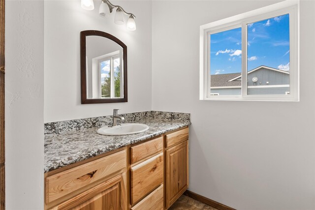 4452 Ludwig Ln, Stevensville, MT 59870 - bathroom featuring vanity and baseboards