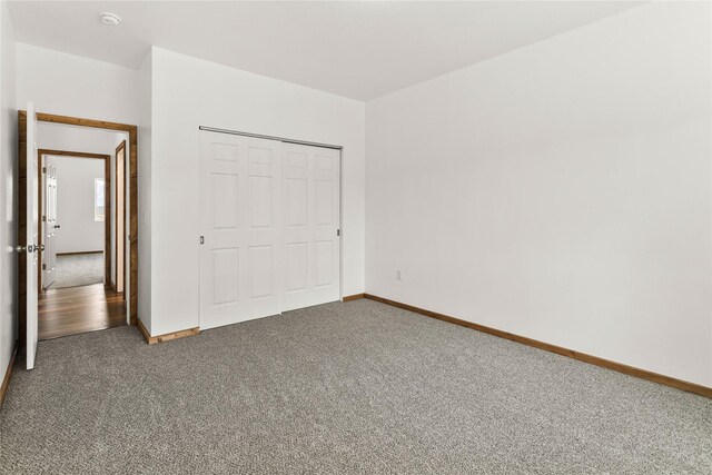 4452 Ludwig Ln, Stevensville, MT 59870 - unfurnished bedroom with carpet, baseboards, and a closet