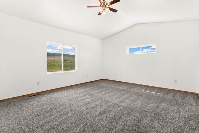 4452 Ludwig Ln, Stevensville, MT 59870 - carpeted empty room with a ceiling fan, lofted ceiling, and baseboards