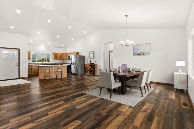 4452 Ludwig Ln, Stevensville, MT 59870 - dining space with dark wood-style floors, a chandelier, recessed lighting, and high vaulted ceiling