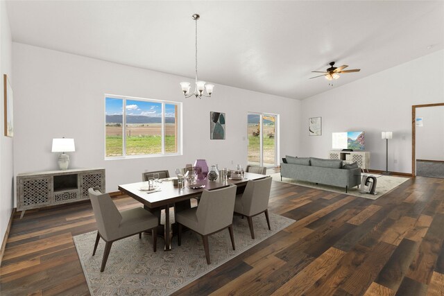 4452 Ludwig Ln, Stevensville, MT 59870 - dining area featuring dark wood-type flooring, a chandelier, vaulted ceiling, and ceiling fan