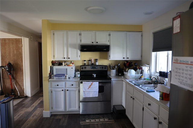 507 2nd St, Valier, MT 59486 - kitchen with stainless steel electric stove, under cabinet range hood, white microwave, refrigerator, and light countertops