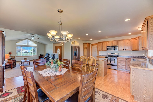 dining space with light wood-style floors, a chandelier, ceiling fan, lofted ceiling, and recessed lighting
