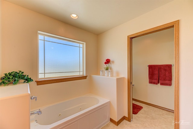 full bath with a jetted tub, baseboards, and recessed lighting