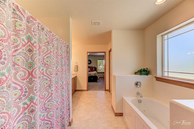 full bathroom featuring a tub with jets, ensuite bath, baseboards, tile patterned floors, and a shower with curtain