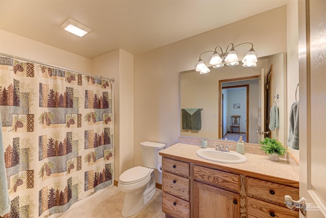 bathroom with tile patterned floors, toilet, vanity, a chandelier, and a shower with curtain