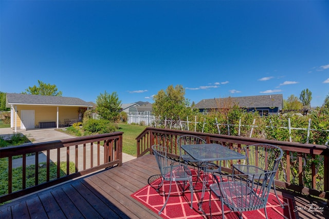 wooden deck with outdoor dining space