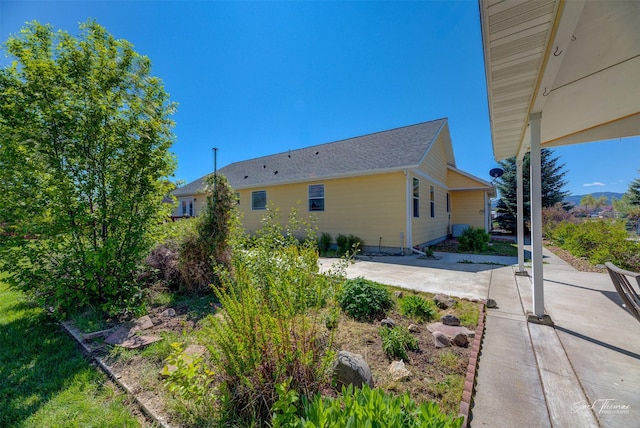view of side of home featuring a patio