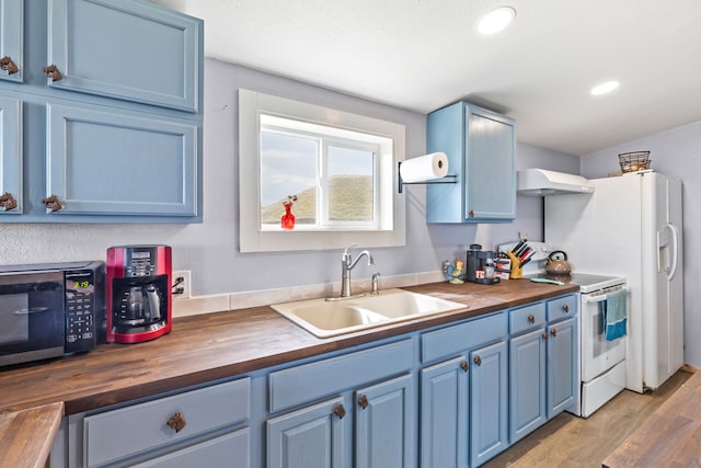49 Embry Ln, Great Falls, MT 59404 - kitchen featuring butcher block countertops, white range with electric stovetop, blue cabinets, custom exhaust hood, and recessed lighting