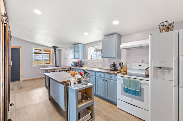 49 Embry Ln, Great Falls, MT 59404 - kitchen with white appliances, blue cabinetry, a center island, lofted ceiling, and butcher block countertops
