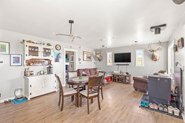 49 Embry Ln, Great Falls, MT 59404 - dining area with light wood-type flooring and a chandelier