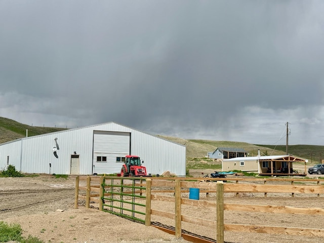 49 Embry Ln, Great Falls, MT 59404 - view of yard featuring a pole building, an outbuilding, and a detached garage