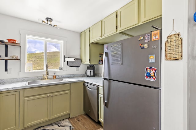 49 Embry Ln, Great Falls, MT 59404 - kitchen with appliances with stainless steel finishes, open shelves, light wood-style floors, and light stone countertops