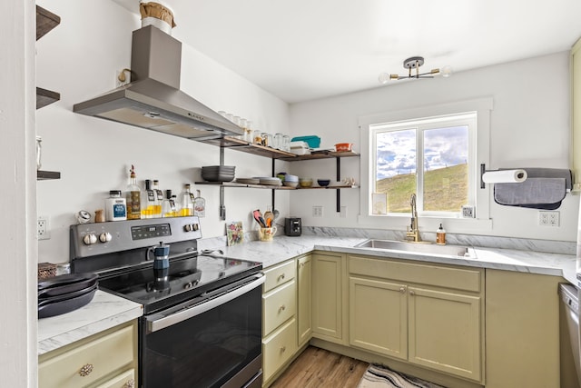 49 Embry Ln, Great Falls, MT 59404 - kitchen featuring stainless steel electric range, extractor fan, light wood-style floors, and light stone countertops