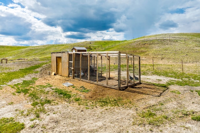 49 Embry Ln, Great Falls, MT 59404 - view of yard featuring a view of countryside, exterior structure, and an outdoor structure