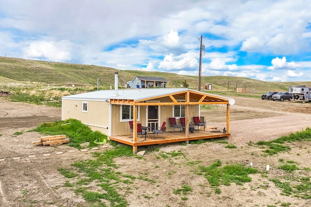 49 Embry Ln, Great Falls, MT 59404 - rear view of property with a deck
