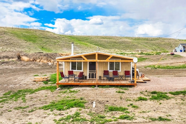 49 Embry Ln, Great Falls, MT 59404 - view of front of home with a wooden deck and a view of countryside