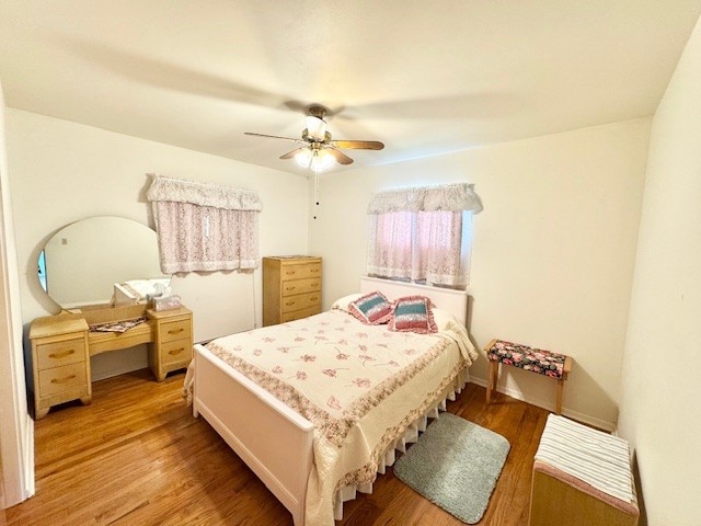 bedroom featuring light wood-style floors and ceiling fan