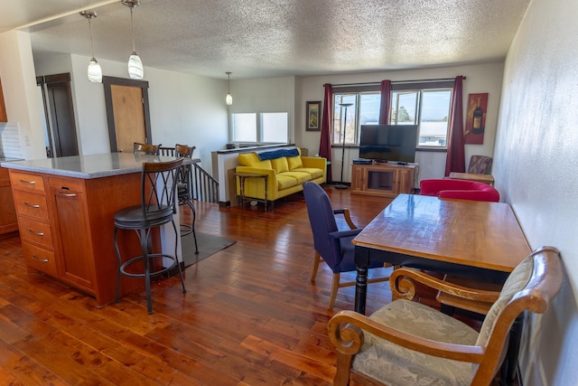 1827 Hollins Ave, Helena, MT 59601 - dining space featuring dark wood-type flooring and a textured ceiling