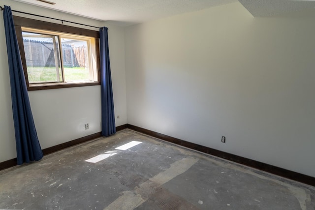 1827 Hollins Ave, Helena, MT 59601 - unfurnished room featuring baseboards and a textured ceiling