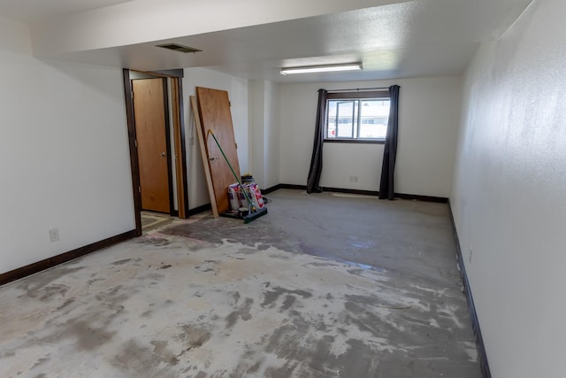 1827 Hollins Ave, Helena, MT 59601 - spare room featuring concrete flooring and baseboards