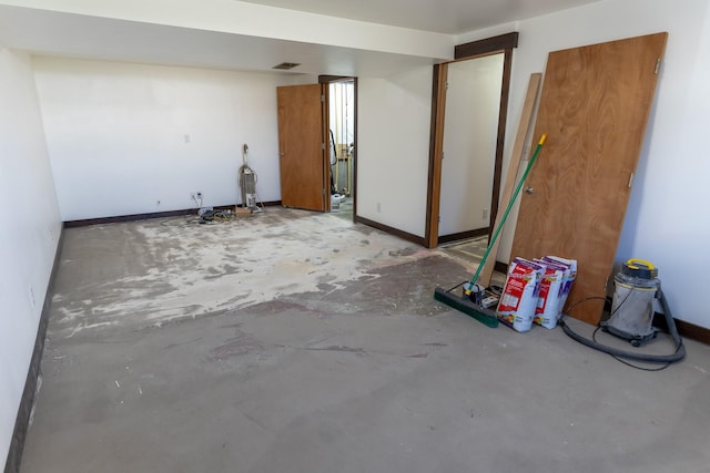 1827 Hollins Ave, Helena, MT 59601 - spare room featuring unfinished concrete floors and baseboards