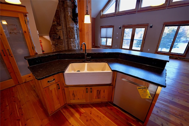 237 N Monture Ct, Seeley Lake, MT 59868 - kitchen with a sink, stainless steel dishwasher, light wood-style floors, and lofted ceiling