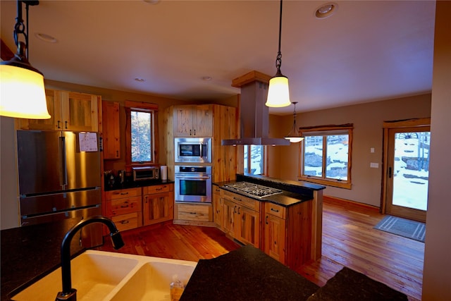 237 N Monture Ct, Seeley Lake, MT 59868 - kitchen featuring stainless steel appliances, a sink, light wood-style flooring, plenty of natural light, and recessed lighting