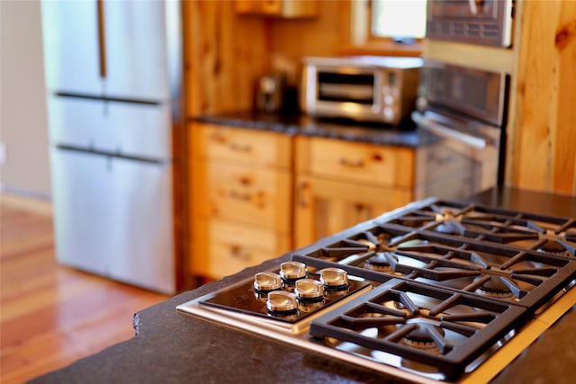 237 N Monture Ct, Seeley Lake, MT 59868 - kitchen with stainless steel gas stovetop and dark countertops
