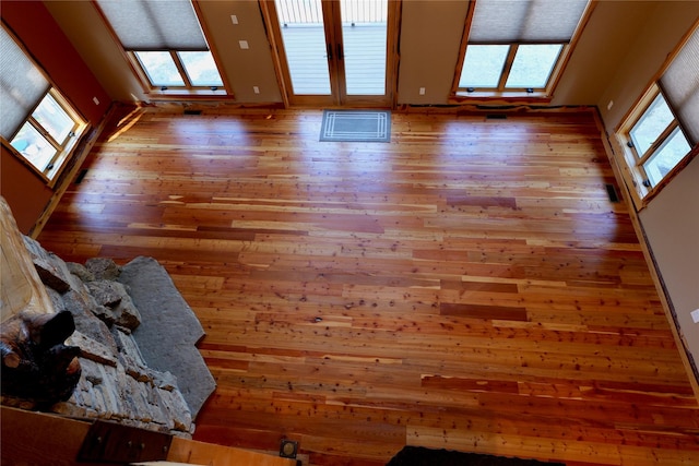 237 N Monture Ct, Seeley Lake, MT 59868 - unfurnished living room featuring hardwood / wood-style floors and healthy amount of natural light