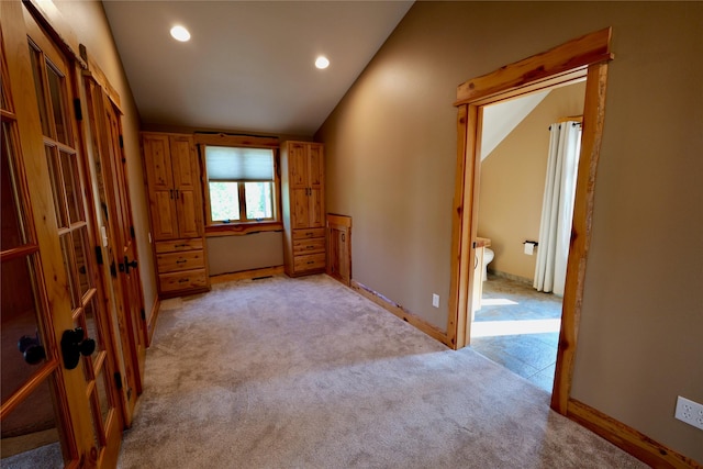 237 N Monture Ct, Seeley Lake, MT 59868 - empty room with light colored carpet, vaulted ceiling, recessed lighting, and baseboards