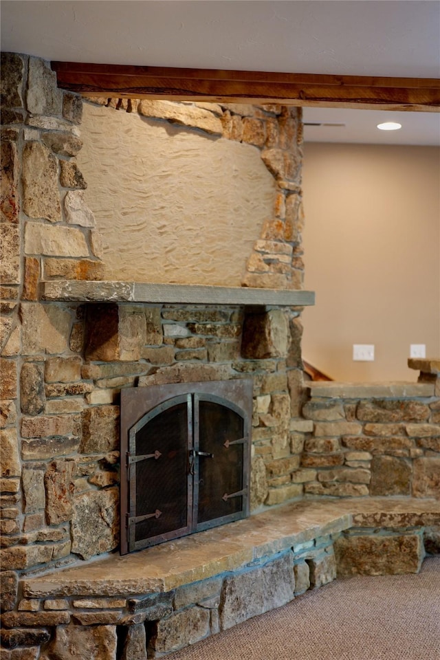 237 N Monture Ct, Seeley Lake, MT 59868 - detailed view of a fireplace, beamed ceiling, and carpet