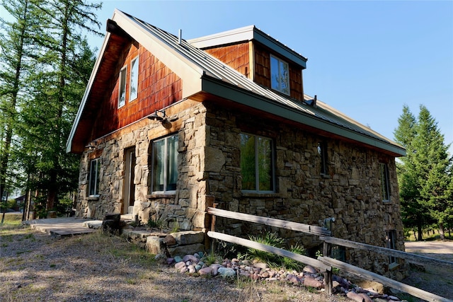 237 N Monture Ct, Seeley Lake, MT 59868 - view of property exterior with stone siding