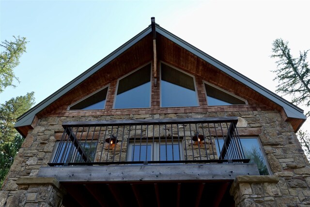237 N Monture Ct, Seeley Lake, MT 59868 - view of side of home featuring stone siding