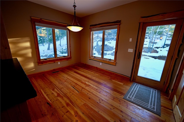 237 N Monture Ct, Seeley Lake, MT 59868 - unfurnished dining area with hardwood / wood-style flooring